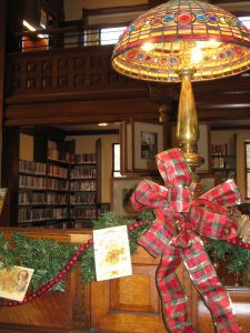 Christmas lights and Bows in the Nevins Library Reading room.