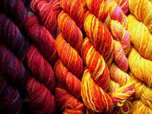 Closeup of red orange and yellow yarn