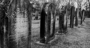 black and white photo of old gravestones