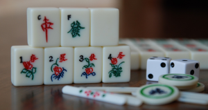 piled up majong tiles and two dice